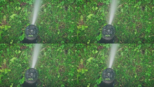 城市花园自动浇水系统的微距拍摄高清在线视频素材下载