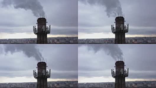 有白烟的烟斗。城市煤气锅炉房的管道，白色的烟雾映衬着天空。从无人机的俯视图。高清在线视频素材下载