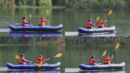 女孩们在湖中划着皮划艇高清在线视频素材下载