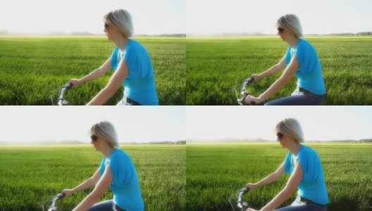 在乡下享受自行车的女人高清在线视频素材下载