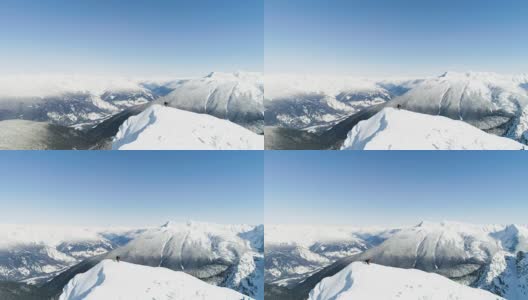 滑雪者站在雪山上4k高清在线视频素材下载
