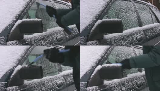 刮掉车上的冰。实时拍摄。高清在线视频素材下载
