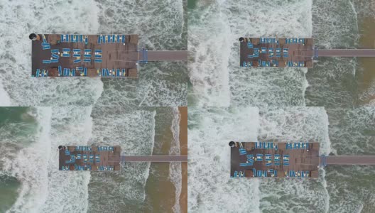 鸟瞰图在一个码头在一个海滩在暴风雨天气高清在线视频素材下载