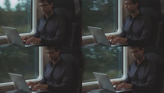 在火车上用笔记本电脑工作的人高清在线视频素材下载