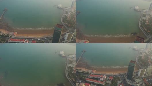 日落时分青岛市著名海滩湾宝塔码头航拍4k中国全景高清在线视频素材下载