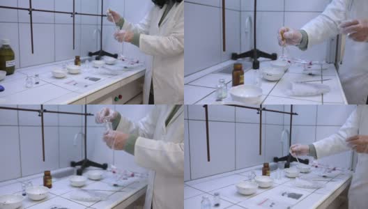 科学家们一边使用吸管和化学试剂，一边戴着石蜡手套，寻找证据的踪迹高清在线视频素材下载