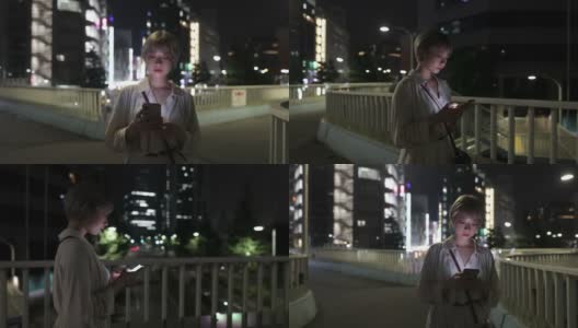年轻女子晚上在城里散步，下班回家高清在线视频素材下载