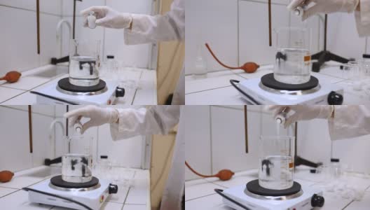 在实验室的玻璃器皿中加热这种物质高清在线视频素材下载