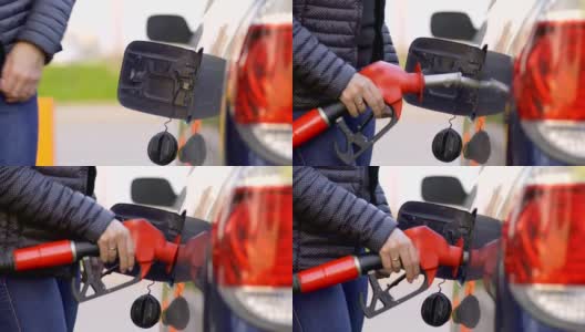 一位妇女在加油站开着一辆汽油车。特写镜头。高清在线视频素材下载