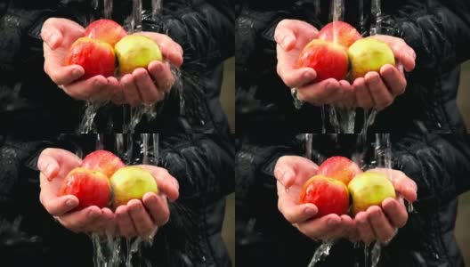 水在人们手中的新鲜苹果上流动高清在线视频素材下载