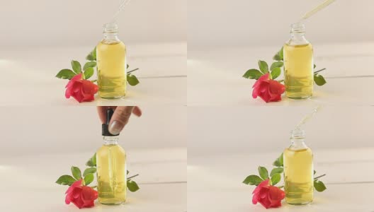玫瑰精华，白色背景，美丽的玻璃瓶高清在线视频素材下载