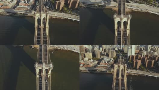 顶部鸟瞰图布鲁克林大桥通过东河到曼哈顿在纽约，美国。旗帜迎风飘扬高清在线视频素材下载