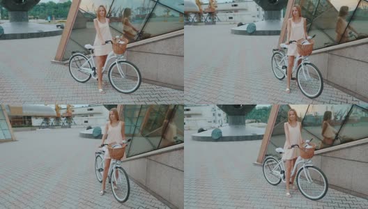 户外时尚肖像优雅的金发女士站在她的时髦复古自行车在时尚的衣服。享受夏日，在港口摆好姿势。女孩微笑。慢动作高清在线视频素材下载