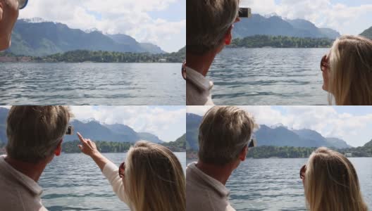 一对夫妇在湖上用智能手机拍照高清在线视频素材下载