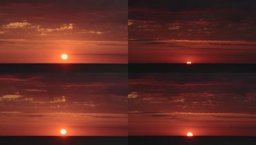 明亮的红色和橙色日落的时间流逝，在海洋上，很少有云高清在线视频素材下载