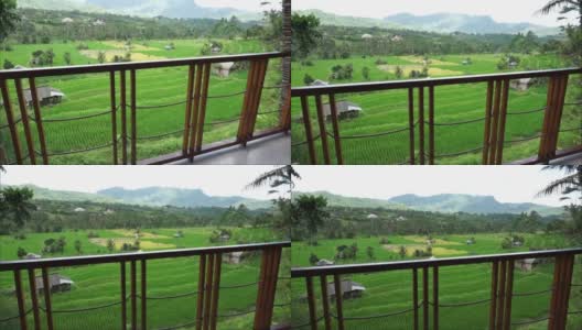 从别墅高清视频观看稻田和小山。巴厘岛Karangasem偏远的塞德门的自然美景。巴厘岛风景视频。高清在线视频素材下载
