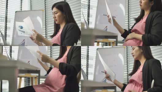 怀孕的办公室女职员在做她的工作高清在线视频素材下载