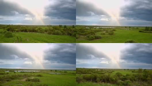 风景如画的彩虹在绿色草地与湖泊上的看法高清在线视频素材下载