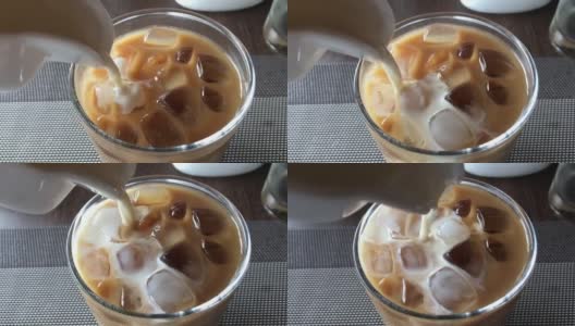 在酒店的冰咖啡中加入牛奶高清在线视频素材下载