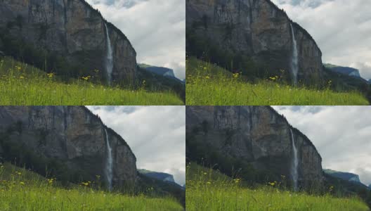 瀑布和草地在春天瑞士伯尔尼Lauterbrunnen高清在线视频素材下载