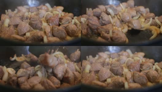 厨师用平底锅煮洋葱和肉高清在线视频素材下载
