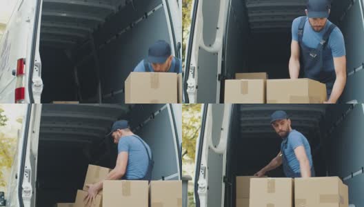 强壮的搬运工从街上往他的货车上装纸箱。高清在线视频素材下载