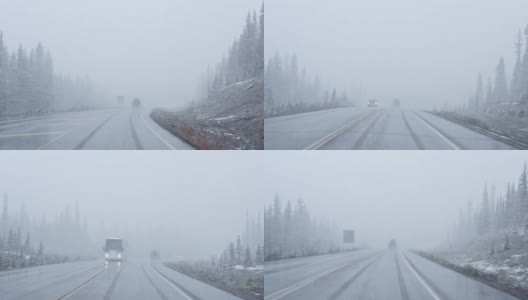 汽车在暴风雪中驾驶，能见度很低的国家公园高清在线视频素材下载
