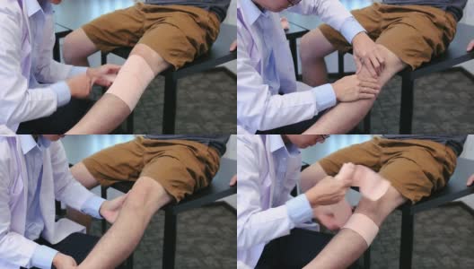 亚洲理疗师正在检查患者的膝盖。高清在线视频素材下载