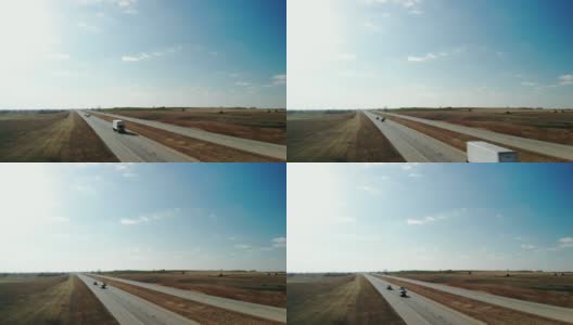 鸟瞰图早春风力涡轮机和中西部州际交通4K视频高清在线视频素材下载