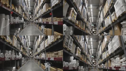 在仓库货架上的箱子之间移动高清在线视频素材下载