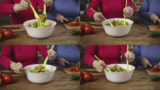 一个女人在搅拌一碗新鲜蔬菜沙拉高清在线视频素材下载
