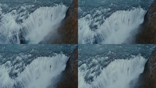 鸟瞰冰岛美丽如画的风景。强大的瀑布Gullfoss坠落在山上高清在线视频素材下载