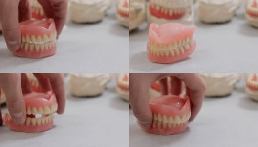 在牙科实验室敲人的牙齿高清在线视频素材下载