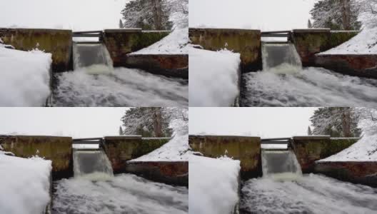 小河上的小水坝，冬天的白天，小河里的小瀑布。高清在线视频素材下载