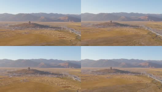 无人机:飞向偏远城市山顶上的一座佛教寺院。高清在线视频素材下载
