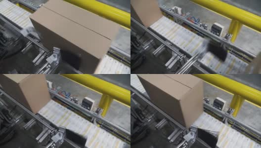 工厂传送带上的纸箱。夹。箱子移动的生产线高清在线视频素材下载