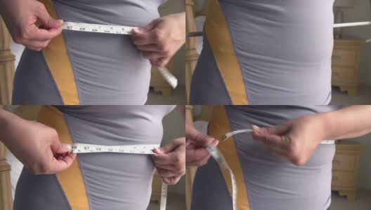 近距离超重妇女测量腰围高清在线视频素材下载