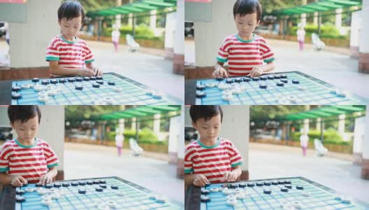亚洲孩子在下中国象棋高清在线视频素材下载
