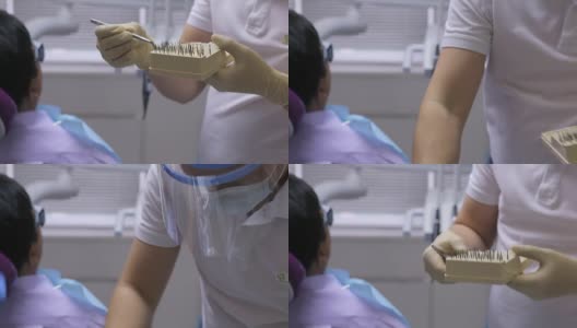 手持医用镊子的牙医正在选择合适的牙钻作为牙科器械高清在线视频素材下载