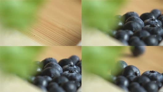 许多蓝莓在木头表面滚动。缓慢的运动。高清在线视频素材下载