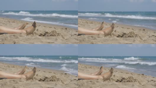 躺在海边沙滩上的女人的腿高清在线视频素材下载