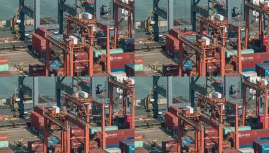 延时:鸟瞰图，在香港货柜港口青衣，由手推车货车卸下货物至货轮高清在线视频素材下载