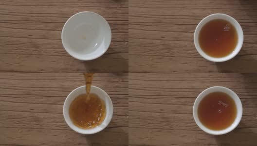 鸟瞰图慢镜头将茶叶倒入杯中高清在线视频素材下载