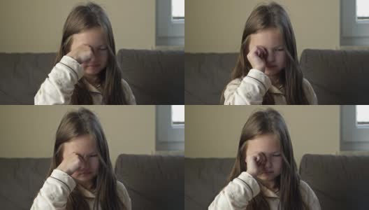 一个6-7岁的小女孩刚醒过来，揉了揉眼睛高清在线视频素材下载