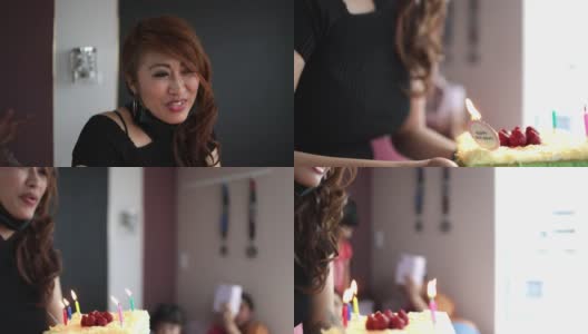 亚洲妇女在家里拿着生日蛋糕高清在线视频素材下载