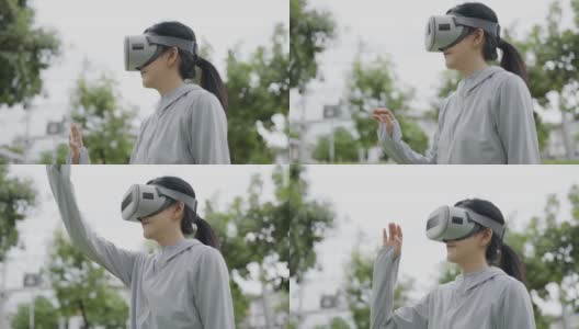 亚洲女性戴着虚拟现实头盔进行拳击锻炼高清在线视频素材下载