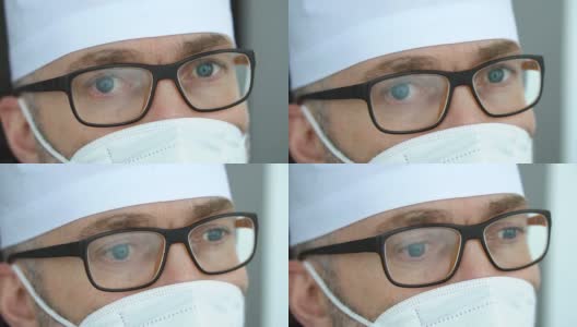 疲惫严重的成熟男性专业医生带着口罩、眼镜和防护服，接走了大量因冠状病毒疫情而感染的患者高清在线视频素材下载