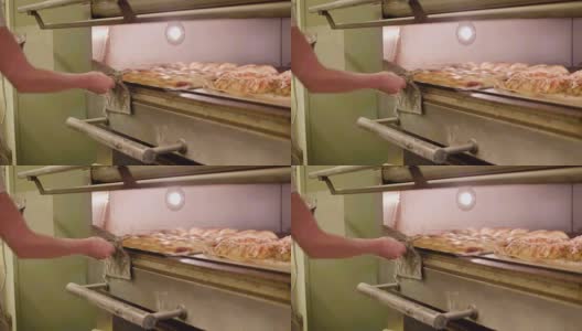 一盘面包滑入烤箱高清在线视频素材下载