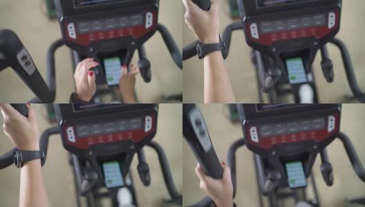 女性在智能手机椭圆机锻炼的PoV高清在线视频素材下载