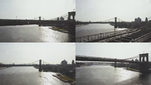 美国纽约东河鸟瞰图。无人机飞过布鲁克林大桥，俯瞰曼哈顿大桥高清在线视频素材下载